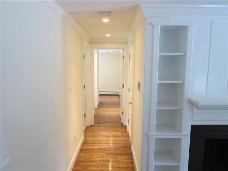 138 South Main Street Centerville, MA 02632 - Photo 18 of 35 a view of a hallway with wooden floor and a bathroom