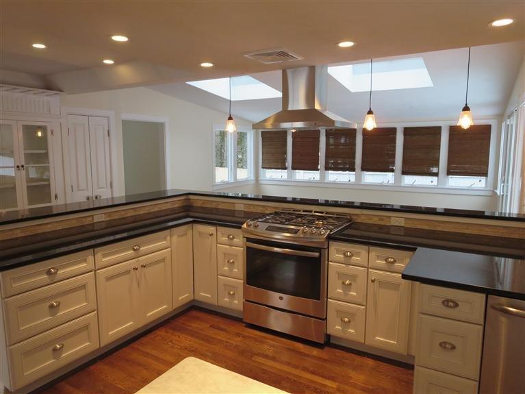 138 South Main Street Centerville, MA 02632 - Photo 2 of 35 a kitchen with stainless steel appliances granite countertop a stove a sink and a microwave
