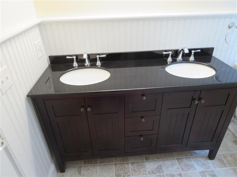 138 South Main Street Centerville, MA 02632 - Photo 21 of 35 a bathroom with a sink vanity and a mirror