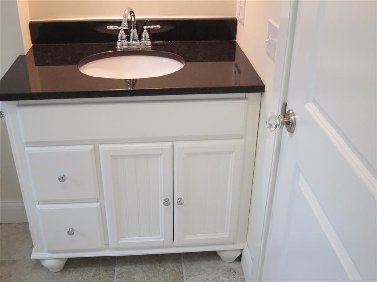 138 South Main Street Centerville, MA 02632 - Photo 28 of 35 a bathroom with a sink and a mirror