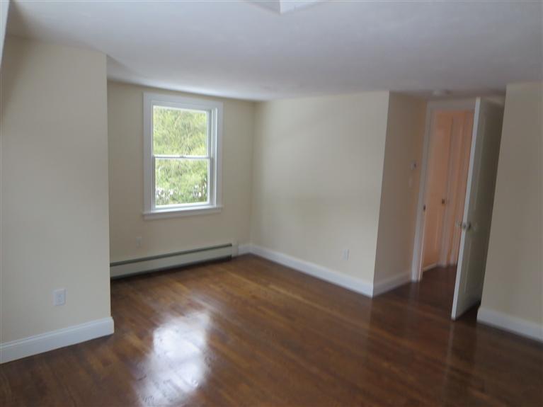 138 South Main Street Centerville, MA 02632 - Photo 30 of 35 an empty room with wooden floor and windows