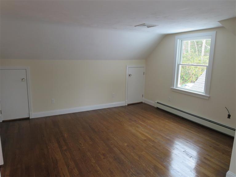 138 South Main Street Centerville, MA 02632 - Photo 31 of 35 an empty room with wooden floor and windows