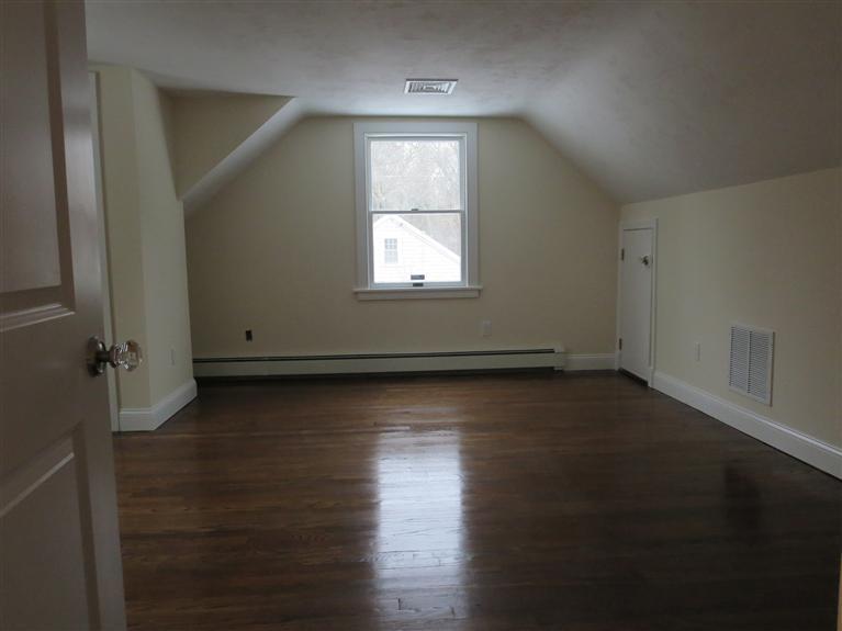 138 South Main Street Centerville, MA 02632 - Photo 32 of 35 an empty room with wooden floor and windows