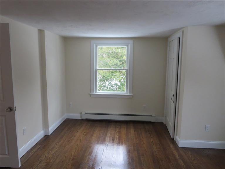 138 South Main Street Centerville, MA 02632 - Photo 33 of 35 an empty room with wooden floor and windows