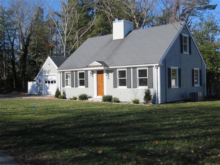 138 South Main Street Centerville, MA 02632 - Photo 4 of 35 a front view of a house with a garden