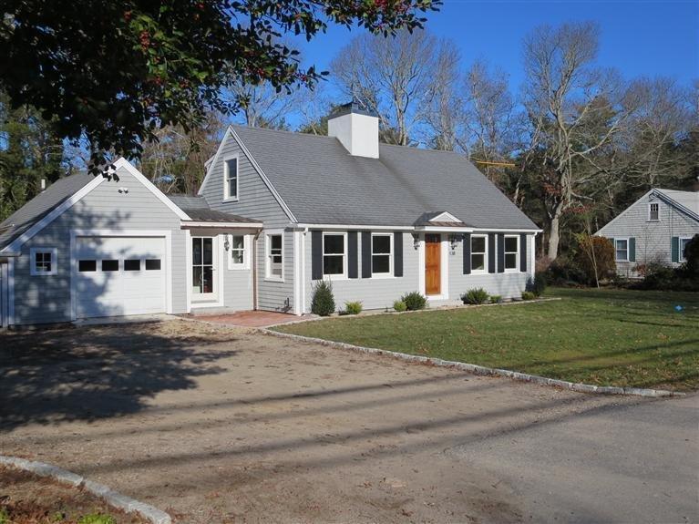 138 South Main Street Centerville, MA 02632 - Photo 5 of 35 a front view of a house with a garden