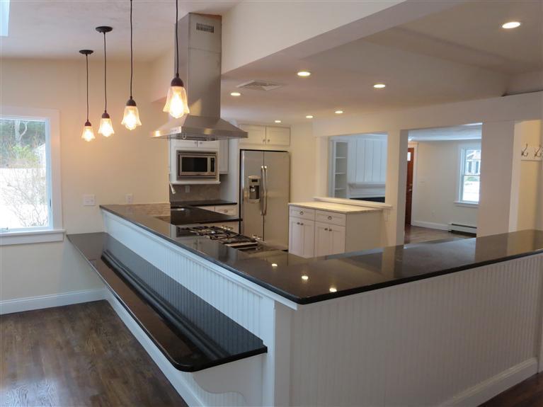 138 South Main Street Centerville, MA 02632 - Photo 9 of 35 a kitchen with kitchen island granite countertop a sink and stainless steel appliances
