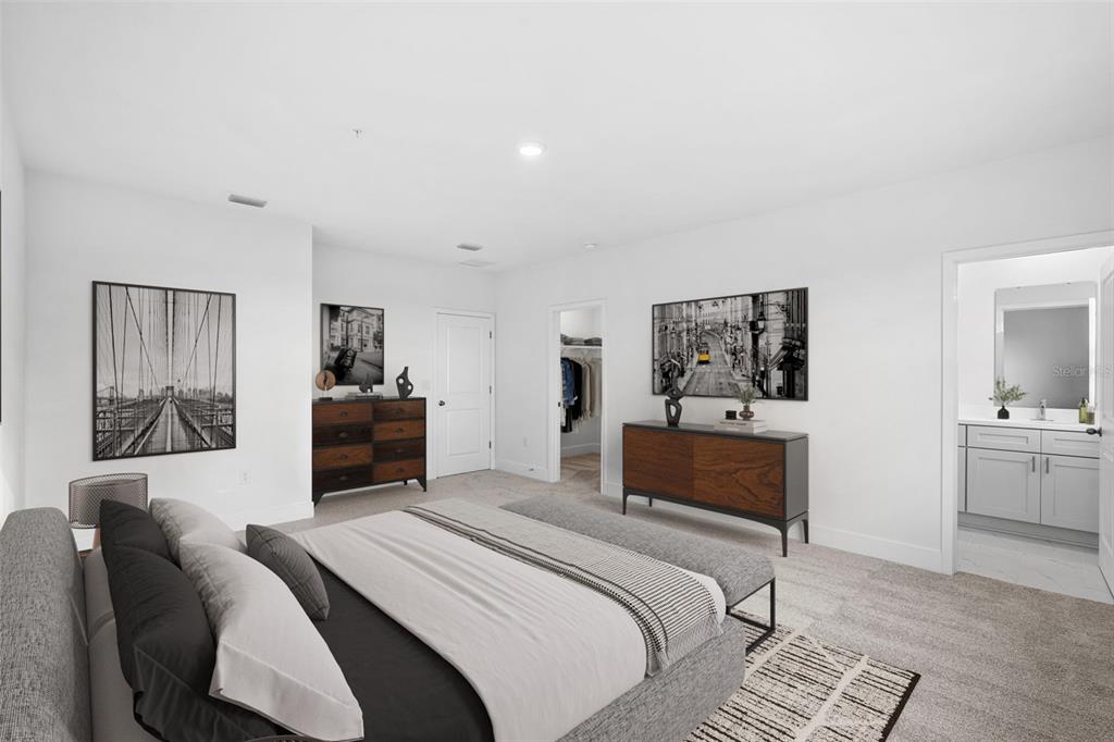 2433 Magnolia Reserve Road Ocoee, FL 34761 - Photo 11 of 14 a bedroom with a bed and a couch