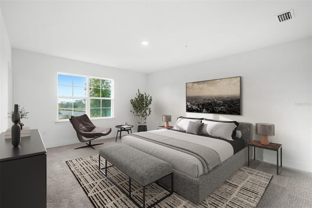 2433 Magnolia Reserve Road Ocoee, FL 34761 - Photo 12 of 14 a bedroom with a bed and a flat screen tv