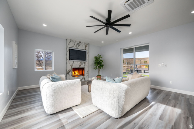 476 Spring Drive Toquerville, UT 84774 - Photo 67 of 95 Living area featuring light wood-style flooring, a ceiling fan, a high end fireplace, and recessed lighting