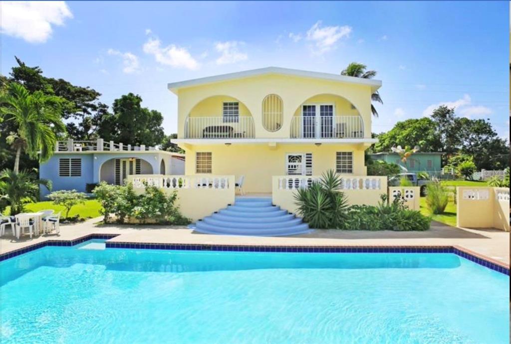 Front of the property with pool