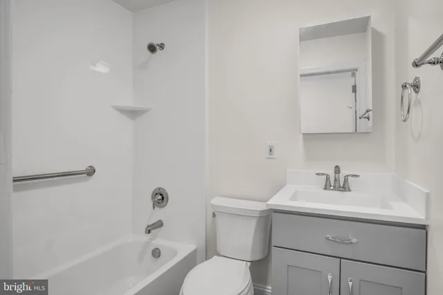 a bathroom with a sink toilet and vanity