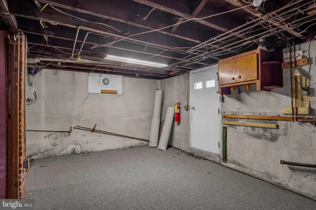 a bathroom with a glass shower door and mirror