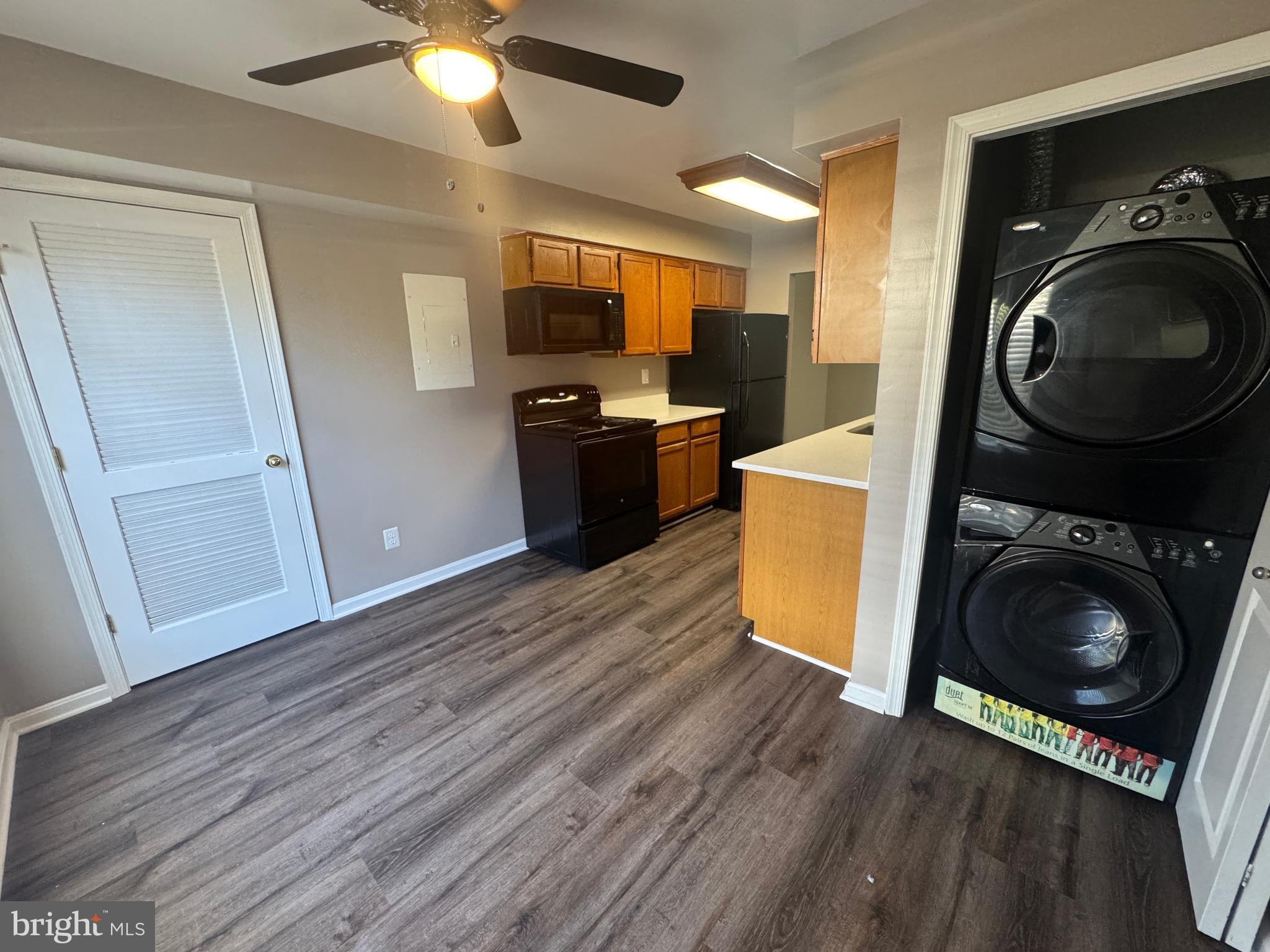 11263 Raging Brook Drive, Unit 253 Bowie, MD 20720 - Photo 13 of 22 a view of a kitchen with a washer and dryer