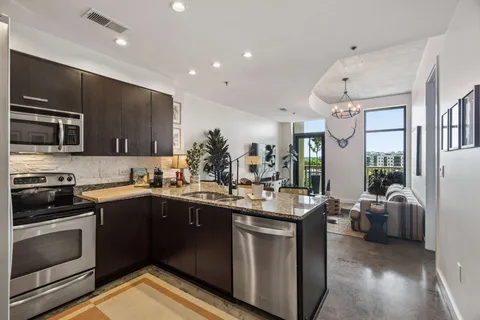 a kitchen with a sink stove and microwave