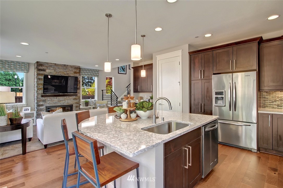 22317 44th Drive Southeast Bothell, WA 98021 - Photo 2 of 14 a kitchen with center island table and chairs