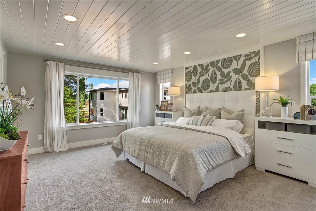 22317 44th Drive Southeast Bothell, WA 98021 - Photo 6 of 14 a spacious bedroom with a large bed and windows