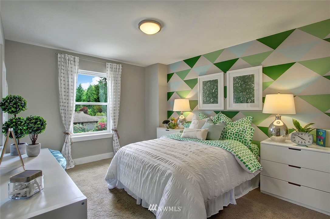 22317 44th Drive Southeast Bothell, WA 98021 - Photo 9 of 14 a bedroom with a bed mirror and window