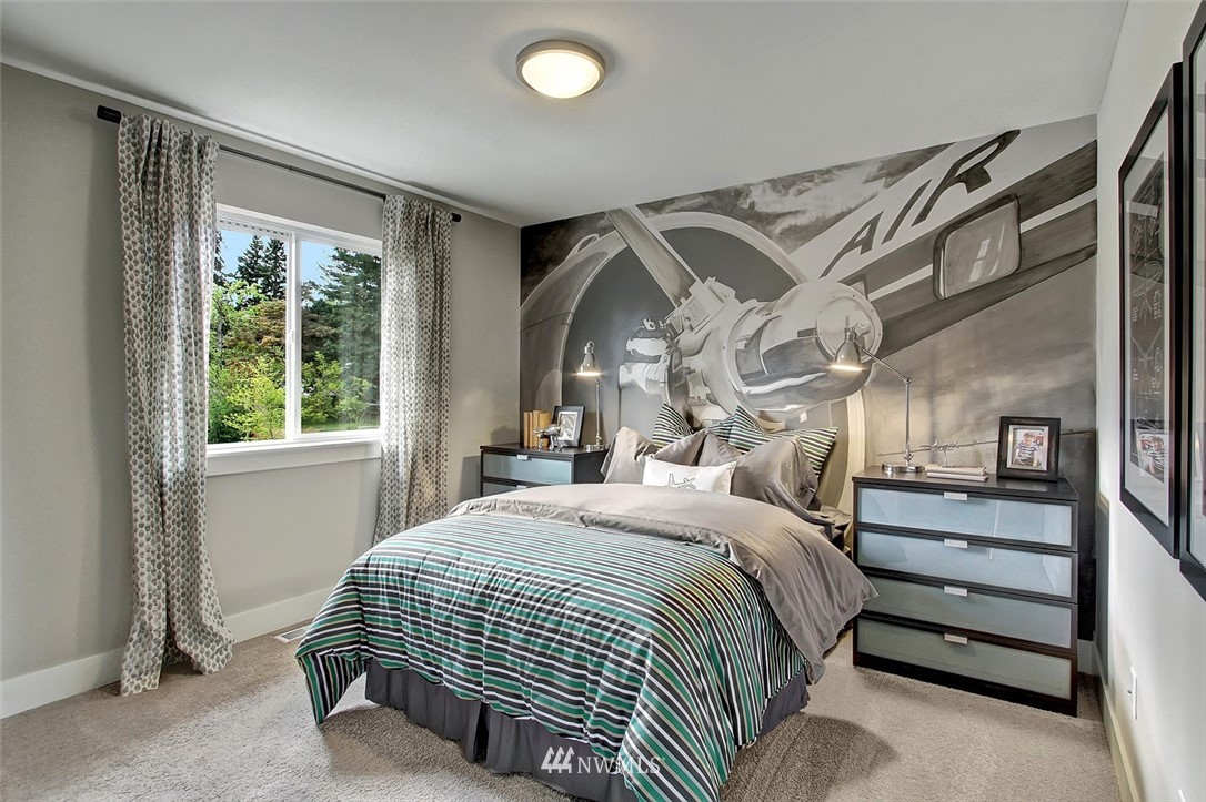 22317 44th Drive Southeast Bothell, WA 98021 - Photo 10 of 14 a bedroom with a bed and a window