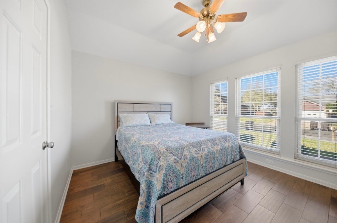 306 Matula Avenue Schulenburg, TX 78956 - Photo 13 of 21 a bed sitting in a bedroom next to a window