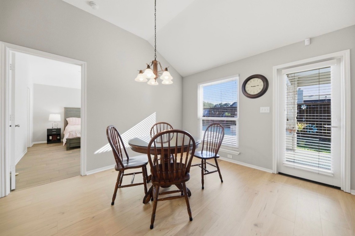 306 Matula Avenue Schulenburg, TX 78956 - Photo 5 of 21 a view of a dining room with furniture window and wooden floor