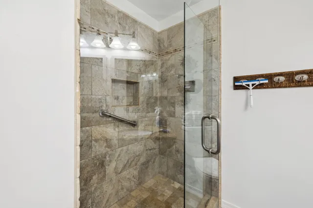 a bedroom with a bed and a television in it