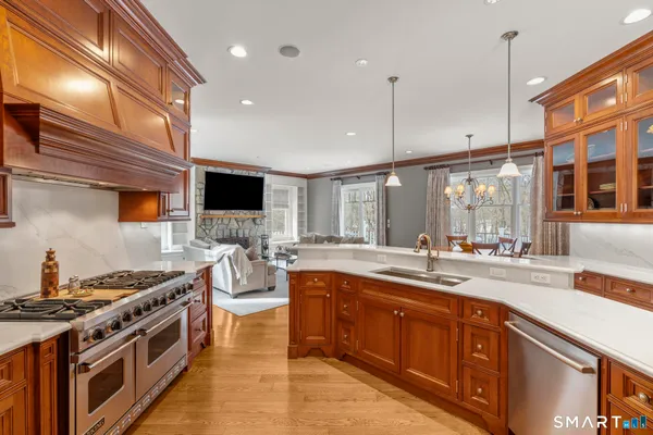 a kitchen with a stove a sink and a microwave