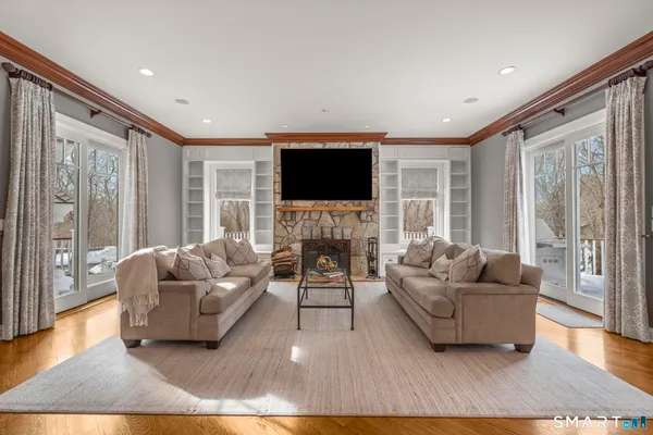a living room with furniture and a flat screen tv