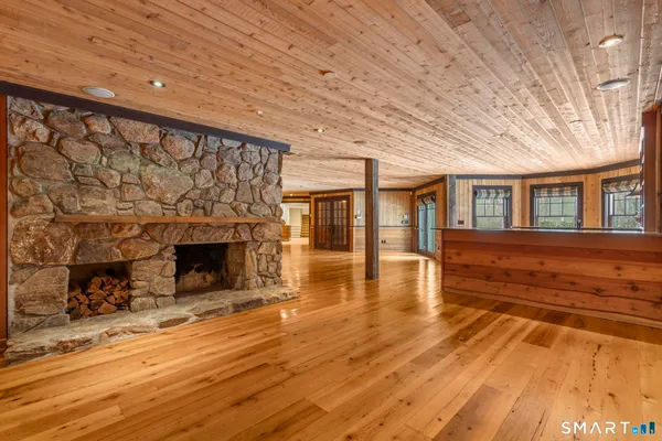 a view of living room with furniture and fireplace