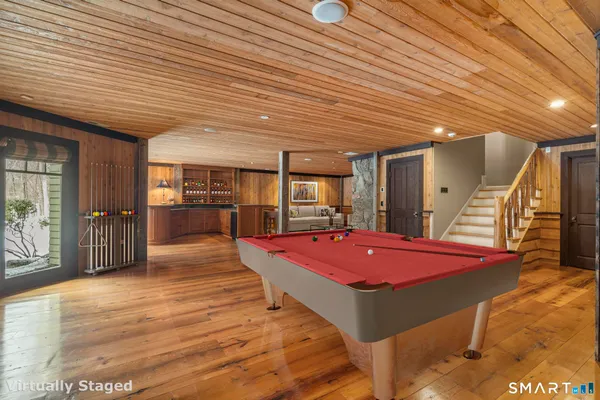 a hall with a table and chairs