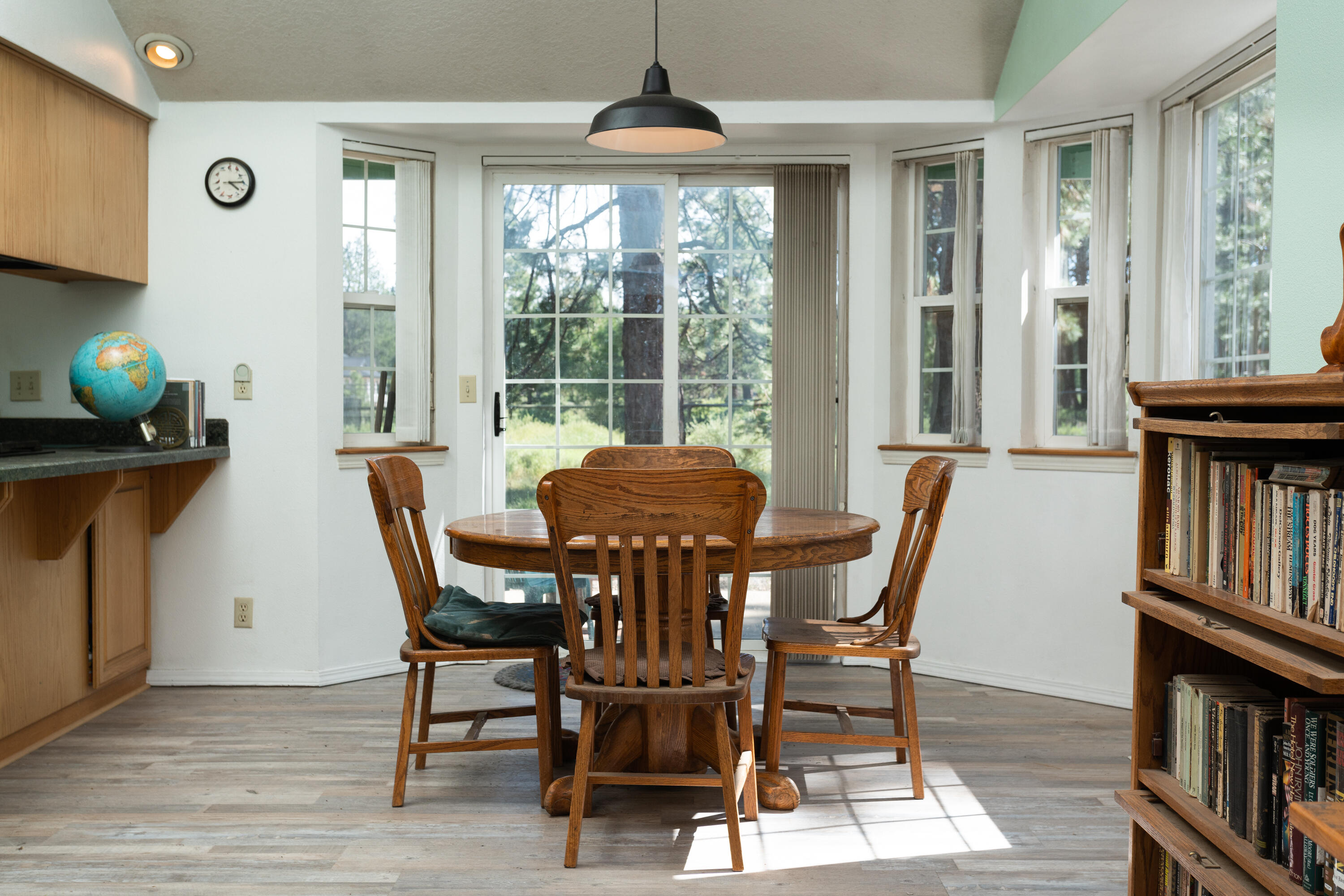 19335 Mohawk Road Bend, OR 97702 - Photo 7 of 24 a view of a dining room with furniture window and wooden floor