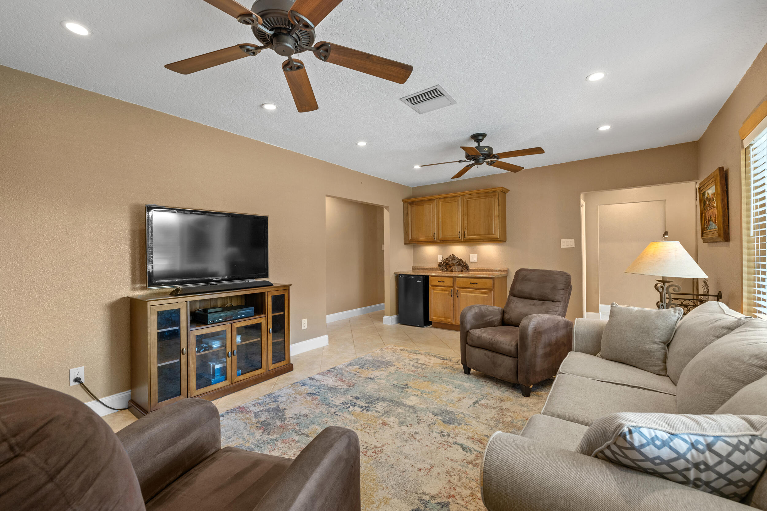 5051 Van Buren Road Delray Beach, FL 33484 - Photo 11 of 55 Living Room With Dry Bar & Natural Light