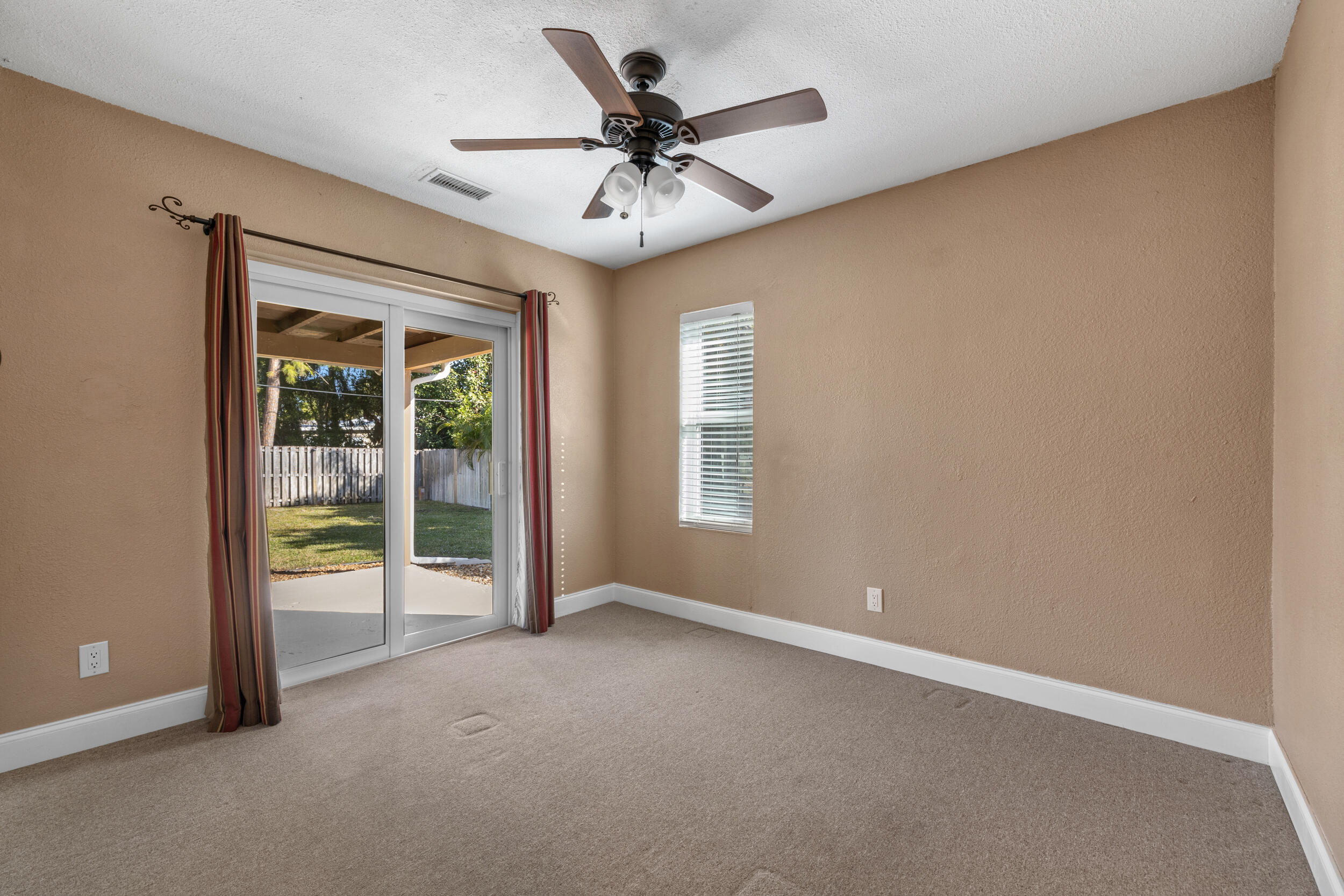5051 Van Buren Road Delray Beach, FL 33484 - Photo 28 of 55 Bedroom 2 with Hurricane Slider to Patio