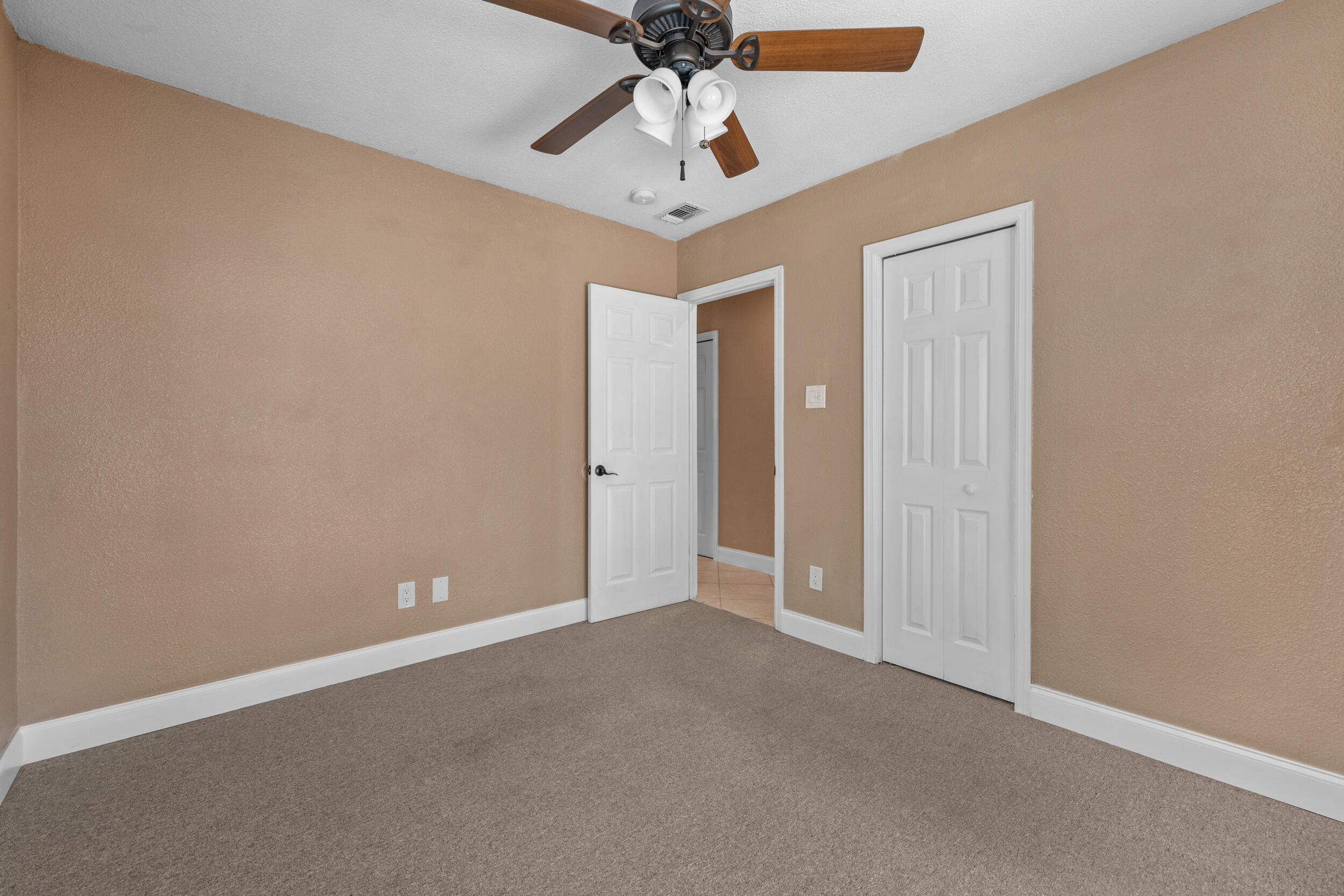 5051 Van Buren Road Delray Beach, FL 33484 - Photo 29 of 55 Bedroom 2 with Hurricane Slider to Patio