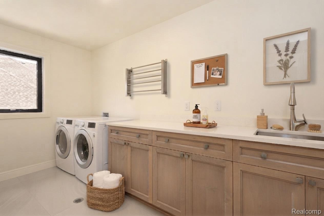 3836 Coachwood Lane Rochester, MI 48309 - Photo 30 of 82 Second Flr Laundry room featuring light wood-finish cabinetry, a white countertop, and a stainless steel sink with a gooseneck faucet