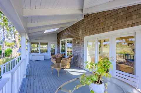 a outdoor living space with furniture and garden view