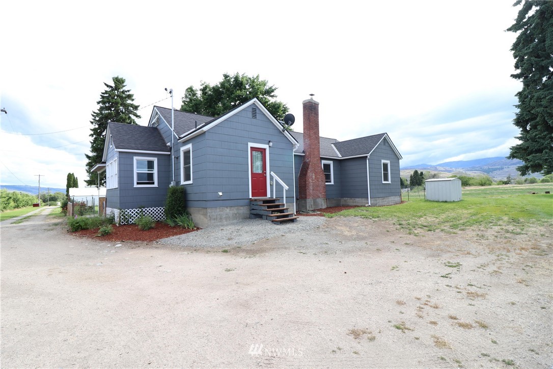 39 Dixon Road Omak, WA 98841 - Photo 2 of 38 a view of a house with a backyard