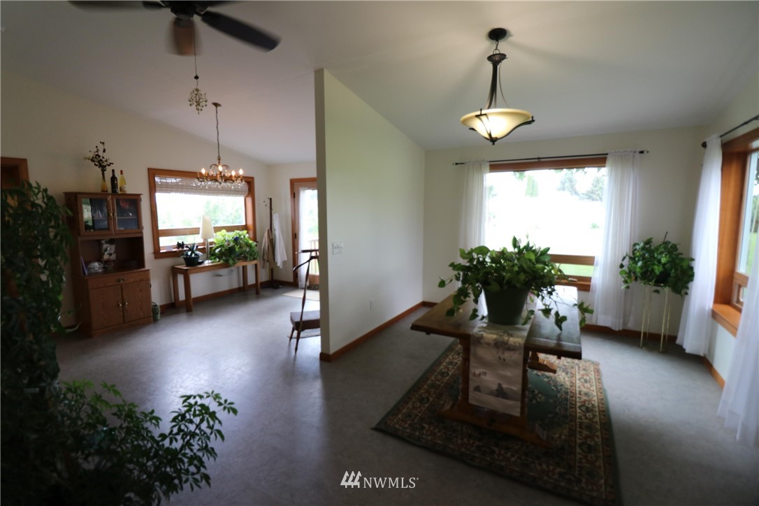 39 Dixon Road Omak, WA 98841 - Photo 20 of 38 a living room with furniture and a chandelier