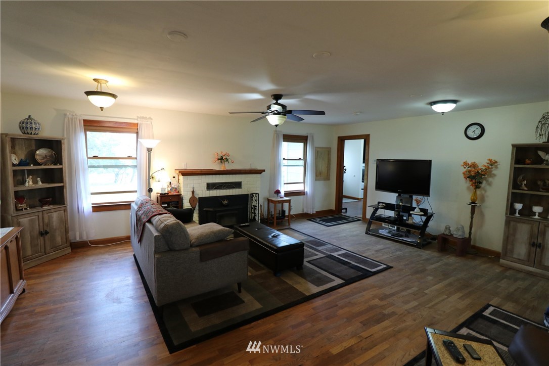 39 Dixon Road Omak, WA 98841 - Photo 21 of 38 a living room with furniture fireplace and a flat screen tv