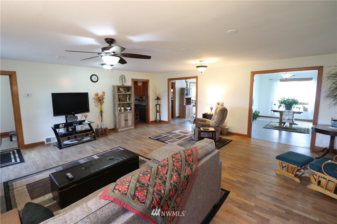 39 Dixon Road Omak, WA 98841 - Photo 25 of 38 a living room with furniture and a flat screen tv