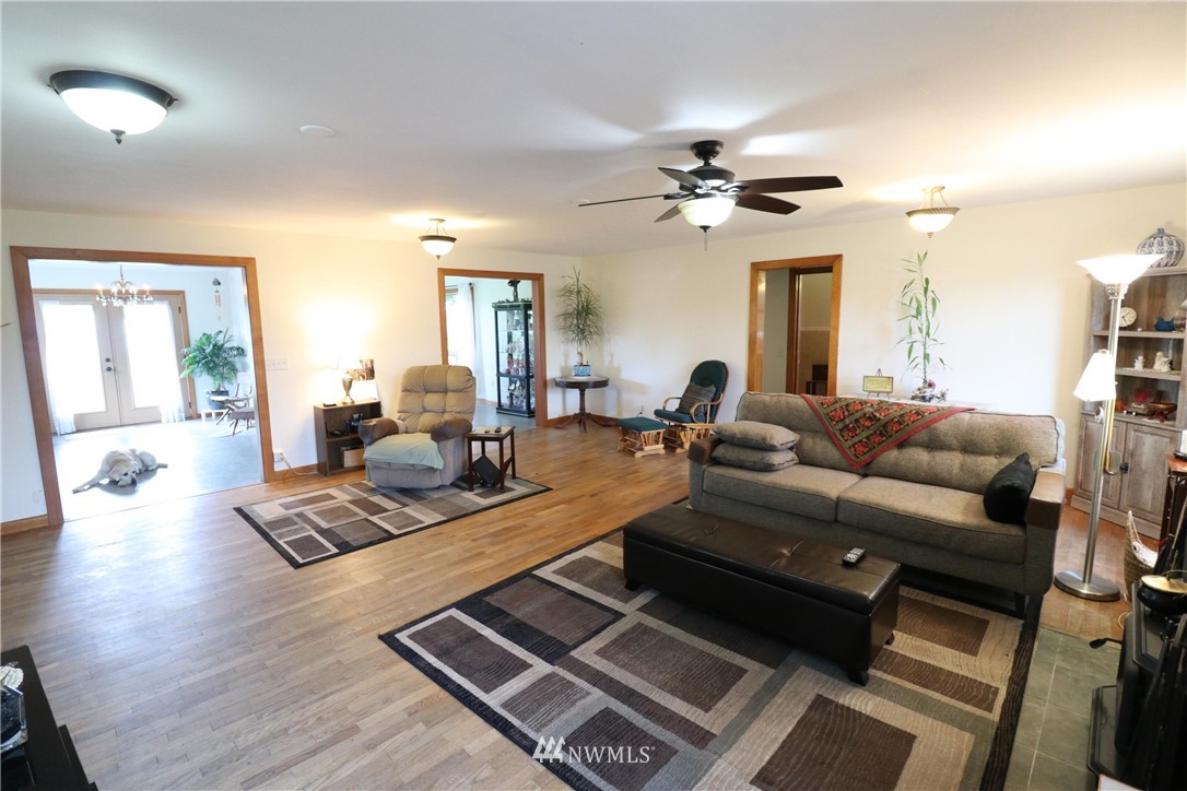 39 Dixon Road Omak, WA 98841 - Photo 26 of 38 a living room with furniture and a chandelier