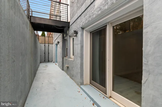 a view of a brick house with a large door