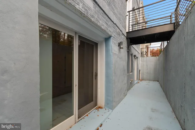 a view of bathroom with a toilet a sink and a mirror