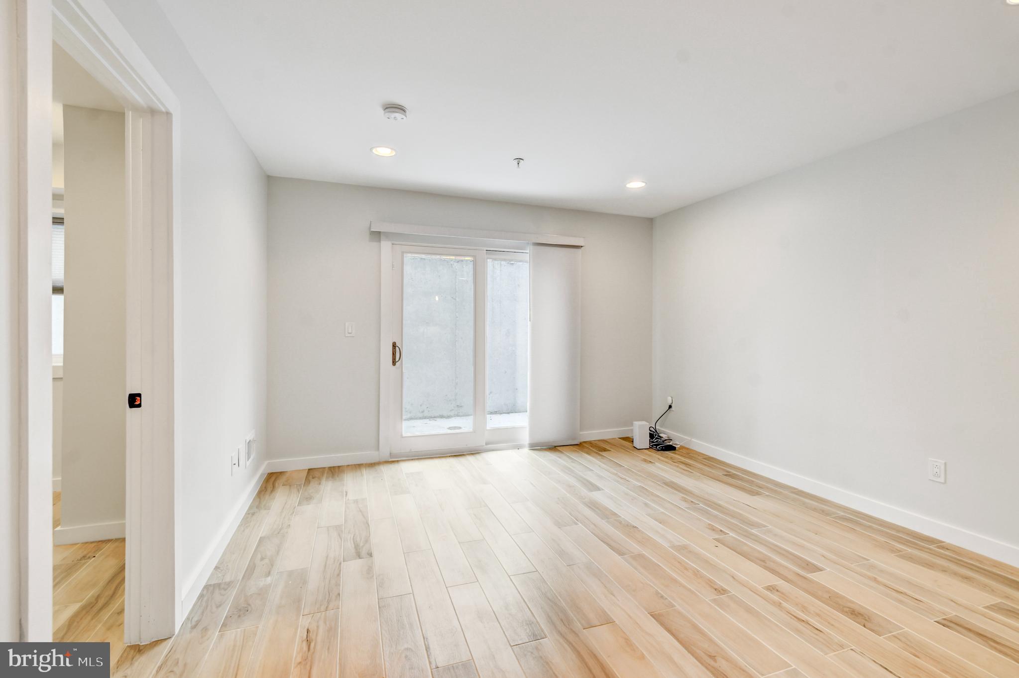 5012 2nd Street Northwest, Unit 2 Washington, DC 20011 - Photo 10 of 30 a view of an empty room with wooden floor