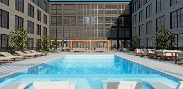 a view of a swimming pool with a lounge chairs