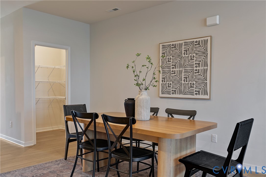1459 Overbrook Road Richmond, VA 23220 - Photo 12 of 39 a view of a dining room with furniture and wooden floor