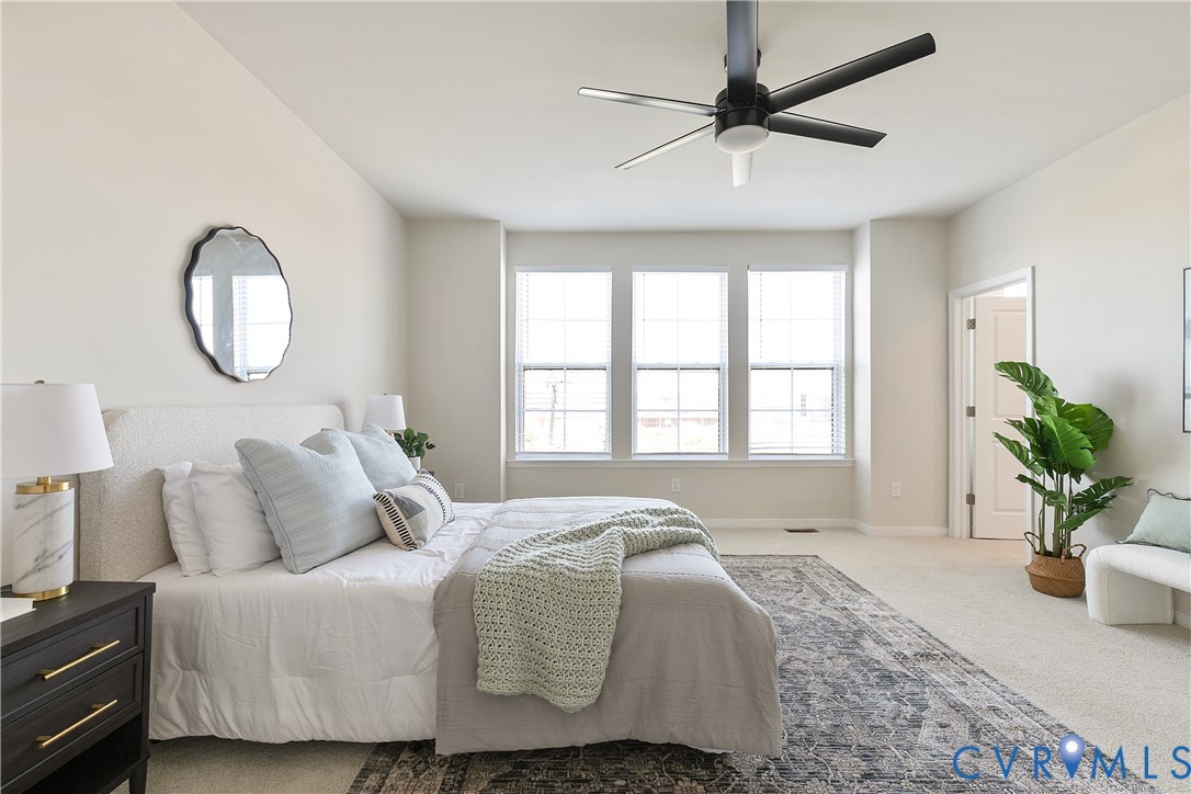 1459 Overbrook Road Richmond, VA 23220 - Photo 22 of 39 a bedroom with a bed and a potted plant