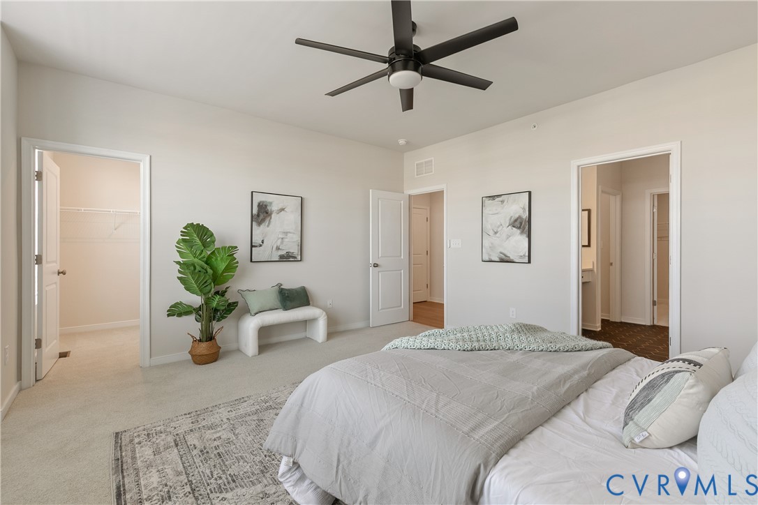 1459 Overbrook Road Richmond, VA 23220 - Photo 23 of 39 a bedroom with a balcony a bed and a chandelier