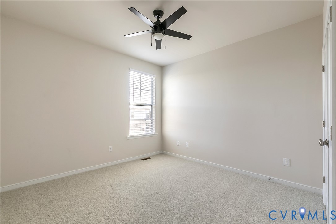 1459 Overbrook Road Richmond, VA 23220 - Photo 28 of 39 an empty room with a window and a fan