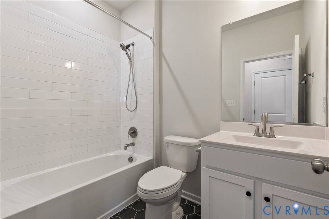 1459 Overbrook Road Richmond, VA 23220 - Photo 30 of 39 a bathroom with a sink toilet and shower